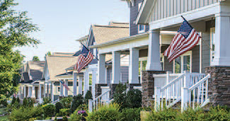 Neighborhood homes flying the American flag.